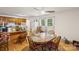 Inviting dining area with a round wooden table, chair seating for four, and natural light from two windows at 1975 Peace Rd, Fort Mill, SC 29715