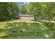 Charming brick home with a well-manicured lawn and a convenient carport for parking at 1975 Peace Rd, Fort Mill, SC 29715