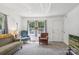 Bright living room with ample natural light from large windows, complemented by comfortable armchairs and neutral decor at 1975 Peace Rd, Fort Mill, SC 29715