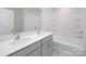 Stylish bathroom featuring double sinks, a tub, and tiled walls at 207 Giant Oak Ave, Statesville, NC 28677