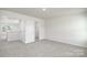 Neutral carpeted bedroom features two closets and is brightly lit at 207 Giant Oak Ave, Statesville, NC 28677
