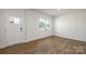 Bright bedroom with hardwood floors, a white door, and natural light at 207 Giant Oak Ave, Statesville, NC 28677