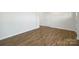 Open entryway featuring hardwood floors and a white door at 207 Giant Oak Ave, Statesville, NC 28677