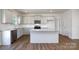 Modern kitchen featuring granite countertops, stainless steel appliances, and a central island at 207 Giant Oak Ave, Statesville, NC 28677