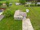 An aerial view of a home with a large yard, long driveway, and several neighboring houses nearby at 210 Stonefield Ln, Salisbury, NC 28146