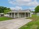 Charming single-story home with a covered front porch and long carport driveway at 210 Stonefield Ln, Salisbury, NC 28146