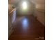 Attic space with finished floors and built-in shelving, offering ample storage or potential for additional living space at 215 S Belvedere Ave, Gastonia, NC 28054