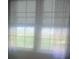 Windows covered by blinds, providing ample natural light and privacy to the room at 215 S Belvedere Ave, Gastonia, NC 28054