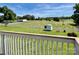 Expansive backyard with a shed and white picket fence, as seen from the deck at 2547 Bill Thompson Rd, Lancaster, SC 29720