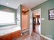 A spacious bathroom features a tub, a glass shower, with lovely fixtures and an entrance to the primary bedroom at 2547 Bill Thompson Rd, Lancaster, SC 29720