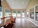 Bright dining area with vaulted ceilings, tile floors, and abundant natural light from large windows at 2547 Bill Thompson Rd, Lancaster, SC 29720