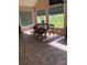 Sunny dining room featuring a wooden table, 6 chairs, and large windows overlooking the landscape at 2547 Bill Thompson Rd, Lancaster, SC 29720