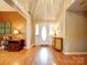 Inviting entryway with warm paint, hardwood floors, and decorative lamps at 2547 Bill Thompson Rd, Lancaster, SC 29720