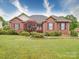 Charming brick home with manicured landscaping and a well-maintained front lawn at 2547 Bill Thompson Rd, Lancaster, SC 29720