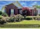 Charming brick home featuring mature landscaping and a well-manicured lawn on a sunny day at 2547 Bill Thompson Rd, Lancaster, SC 29720