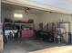 Spacious garage, features a concrete floor, white walls, shelving, and overhead lighting at 2547 Bill Thompson Rd, Lancaster, SC 29720