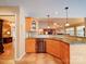 Kitchen featuring wooden cabinetry, granite countertops, backsplash and stainless steel appliances, opens to living area at 2547 Bill Thompson Rd, Lancaster, SC 29720