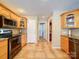 Kitchen with wood cabinetry, granite countertops, stainless appliances, and tile floor at 2547 Bill Thompson Rd, Lancaster, SC 29720