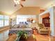 Sunlit living room with vaulted ceiling, hardwood floors, and open access to the kitchen for seamless entertaining at 2547 Bill Thompson Rd, Lancaster, SC 29720