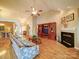 Bright living room with a fireplace, media center, and lots of natural light, ideal for Gathering gatherings at 2547 Bill Thompson Rd, Lancaster, SC 29720
