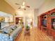 Open-concept living space featuring hardwood floors, a vaulted ceiling, and seamless transition to the kitchen and foyer at 2547 Bill Thompson Rd, Lancaster, SC 29720