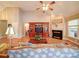 Bright living room with a fireplace, media center, and hardwood floors, perfect for entertaining at 2547 Bill Thompson Rd, Lancaster, SC 29720