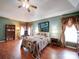 Bedroom with vaulted ceilings, a ceiling fan, hardwood floors, and decor at 2547 Bill Thompson Rd, Lancaster, SC 29720