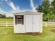 Exterior view of a white shed in the backyard with window and double door at 2547 Bill Thompson Rd, Lancaster, SC 29720