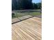 Close up on wood deck featuring light beige wood planking and white railing at 2547 Bill Thompson Rd, Lancaster, SC 29720