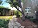 View of backyard stone path and professionally landscaped backyard at 3000 J R Ct, Stanley, NC 28164