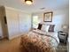 Charming bedroom with a decorative bed, plush pillows, and a window that lets in natural light for a restful retreat at 3000 J R Ct, Stanley, NC 28164