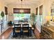 Inviting dining room with modern light fixture and serene backyard view at 3000 J R Ct, Stanley, NC 28164