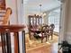 Formal dining room featuring a large window, wooden table with seating for six, and hardwood floors at 3000 J R Ct, Stanley, NC 28164