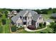 Beautiful two-story brick home featuring a well-manicured lawn and mature landscaping with a classic design and inviting curb appeal at 3000 J R Ct, Stanley, NC 28164