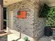 Charming brick exterior entrance with a wooden American flag and welcoming doorway at 3000 J R Ct, Stanley, NC 28164