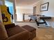 Fun game room with air hockey, arcade game, seating, and neutral-toned carpet at 3000 J R Ct, Stanley, NC 28164