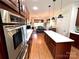 Spacious kitchen with eat-in island and stainless steel appliances at 3000 J R Ct, Stanley, NC 28164