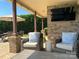 Relaxing covered patio seating area with an outdoor TV, perfect for entertaining at 3000 J R Ct, Stanley, NC 28164