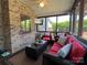 Cozy screened-in porch with brick walls and plush red seating at 3000 J R Ct, Stanley, NC 28164