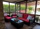 Relaxing screened porch with comfortable seating and view of landscaped backyard at 3000 J R Ct, Stanley, NC 28164