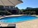 Beautiful backyard swimming pool with lounge chairs and manicured landscaping at 3000 J R Ct, Stanley, NC 28164