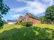 The spacious backyard and brick house offer a beautiful outdoor living space at 3124 Fairmead Dr, Concord, NC 28025
