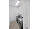 Functional laundry room with modern washer and dryer and overhead cabinetry at 3124 Fairmead Dr, Concord, NC 28025