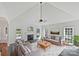Bright living room with fireplace, vaulted ceiling, and views of the pool at 3124 Fairmead Dr, Concord, NC 28025