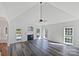 Bright living room with fireplace, vaulted ceiling, and views of the yard at 3124 Fairmead Dr, Concord, NC 28025