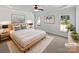 Stylishly staged main bedroom with neutral tones, a ceiling fan, and natural light at 3124 Fairmead Dr, Concord, NC 28025