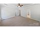 Bright main bedroom with neutral carpeting, and featuring a tray ceiling and ensuite bathroom at 3124 Fairmead Dr, Concord, NC 28025
