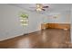 Inviting living room featuring hardwood floors, wainscotting, and a decorative chandelier at 322 S Vine St, Gastonia, NC 28052