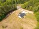 Aerial view of the home showing the driveway and surrounding green landscape at 3650 Sentry Rd, Lancaster, SC 29720