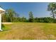 Expansive backyard featuring lush green grass and mature trees at 3650 Sentry Rd, Lancaster, SC 29720